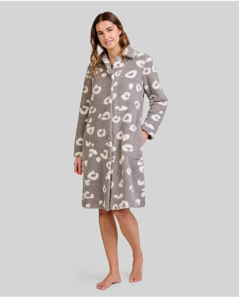 Woman wears knee-length grey fleece robe with white animal patterns and two pockets