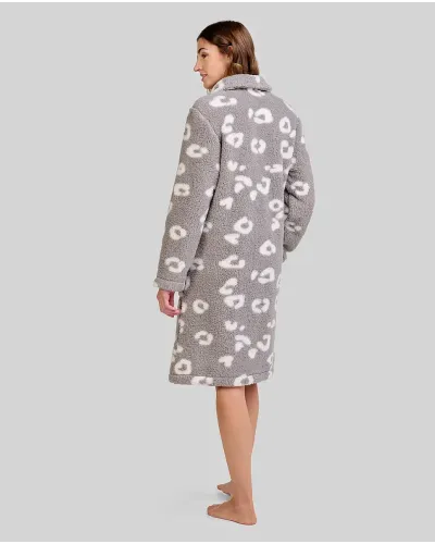 Woman wears knee-length grey fleece robe with white animal patterns and two pockets
