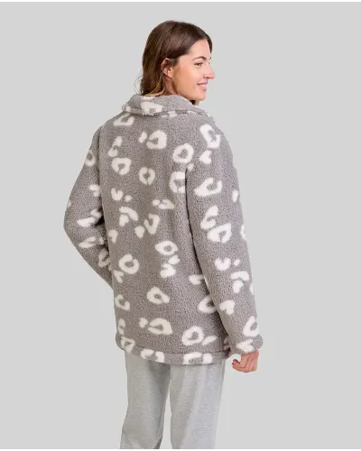 Woman wears short grey button-up robe with animal print over grey pyjamas