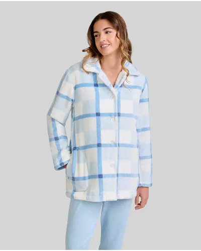 Woman wearing a short blue and white checked robe with buttons and side pockets.