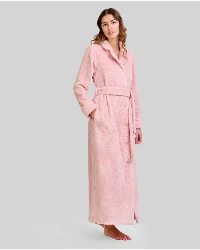 Woman wearing a long, elegant pale pink Jacquard dressing gown with a lapel collar, buttons, belt and side pockets.