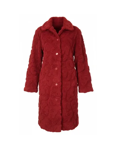 Woman wearing a long, buttoned winter coat with pockets in lovely maroon jacquard fabric