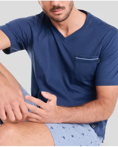 Man wearing blue palm tree print summer pyjama shorts