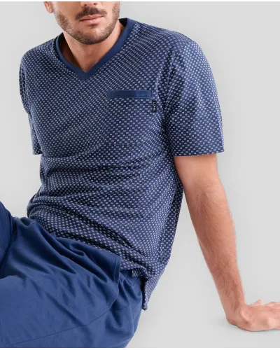 Man wearing blue printed summer pyjama shorts with a tie-style design