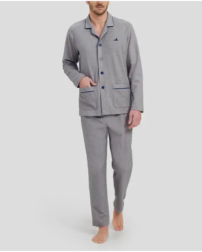 Man in grey plain winter pyjamas with blue piping on the collar