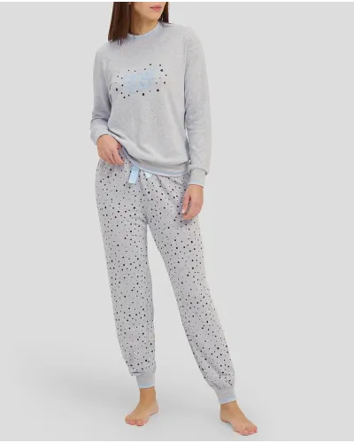 Woman in grey long winter pyjamas with closed collar and cuffs