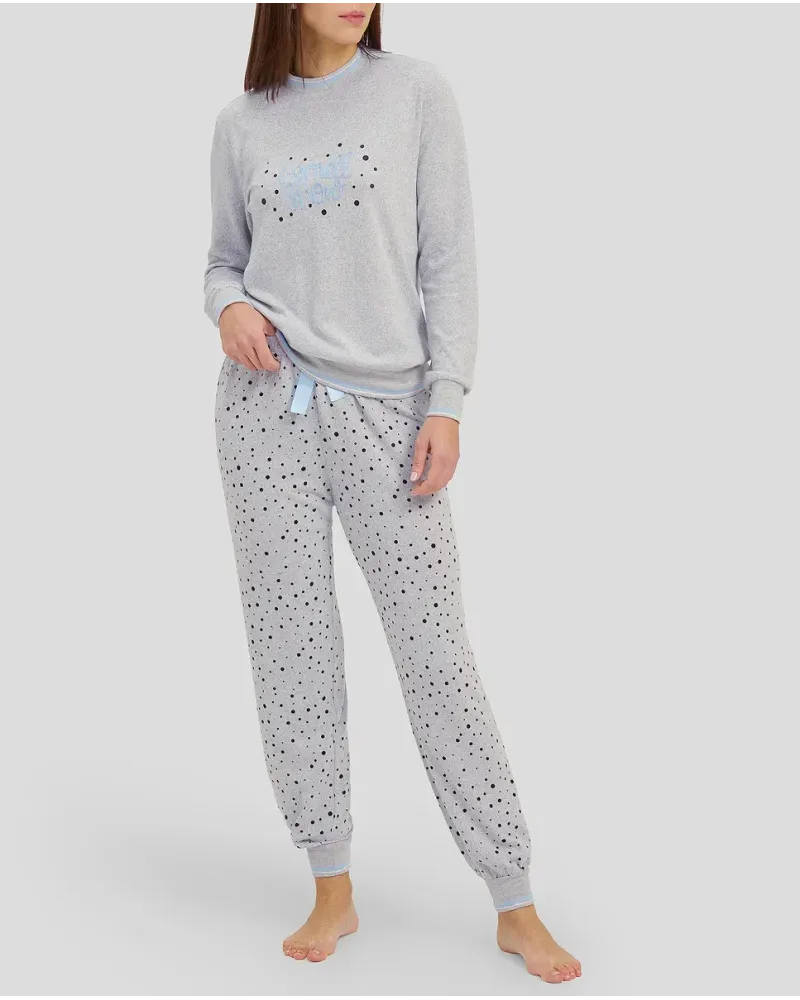 Woman in grey long winter pyjamas with closed collar and cuffs
