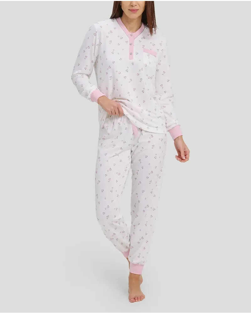 woman with long winter pyjamas with pink heart print