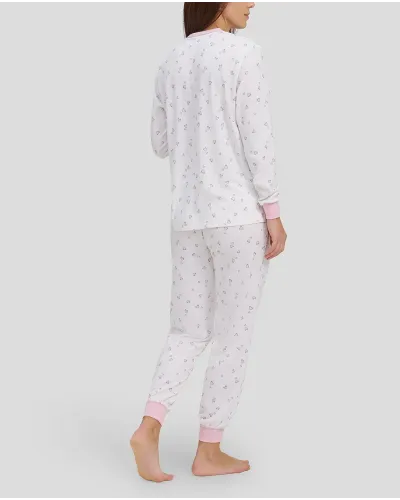 woman with long winter pyjamas with pink heart print
