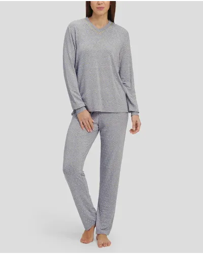 Woman in grey winter pyjamas with diamond pattern with cuffs and V-neck collar