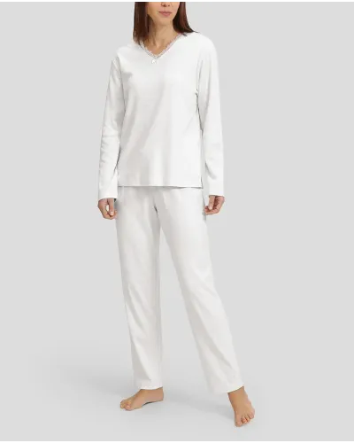 Woman in ivory winter lingerie pyjamas with V-neck and lace