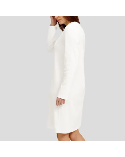 Woman in ivory long-sleeved nightgown for winter with louvres