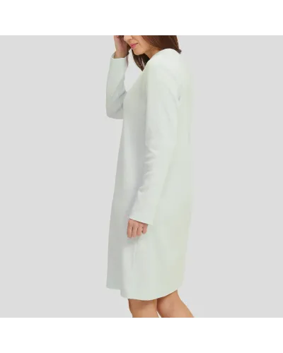 Woman in soft green long-sleeved nightgown for winter with louvers