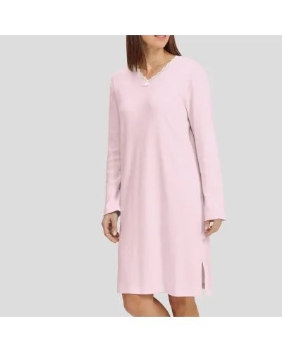 Woman in pink long-sleeved winter lingerie nightgown with V-neck and lace collar