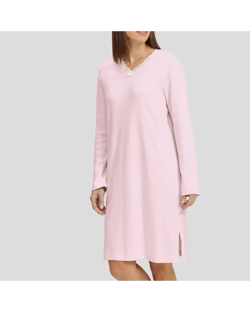 Woman in pink long-sleeved winter lingerie nightgown with V-neck and lace collar