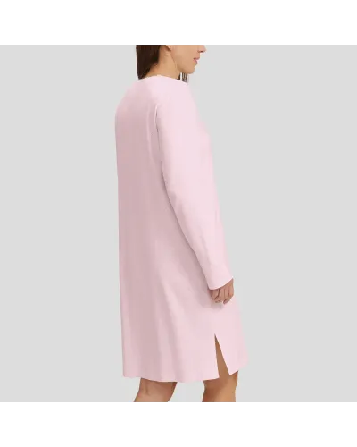 Woman in pink long-sleeved winter lingerie nightgown with V-neck and lace collar