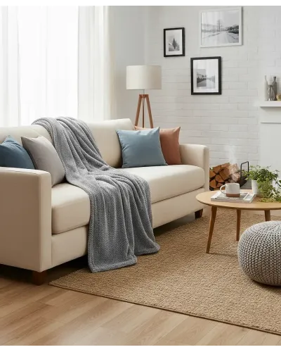Cosy, warm grey herringbone blanket on the sofa