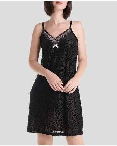 Woman in short black flocked strapless nightdress with lace trimming