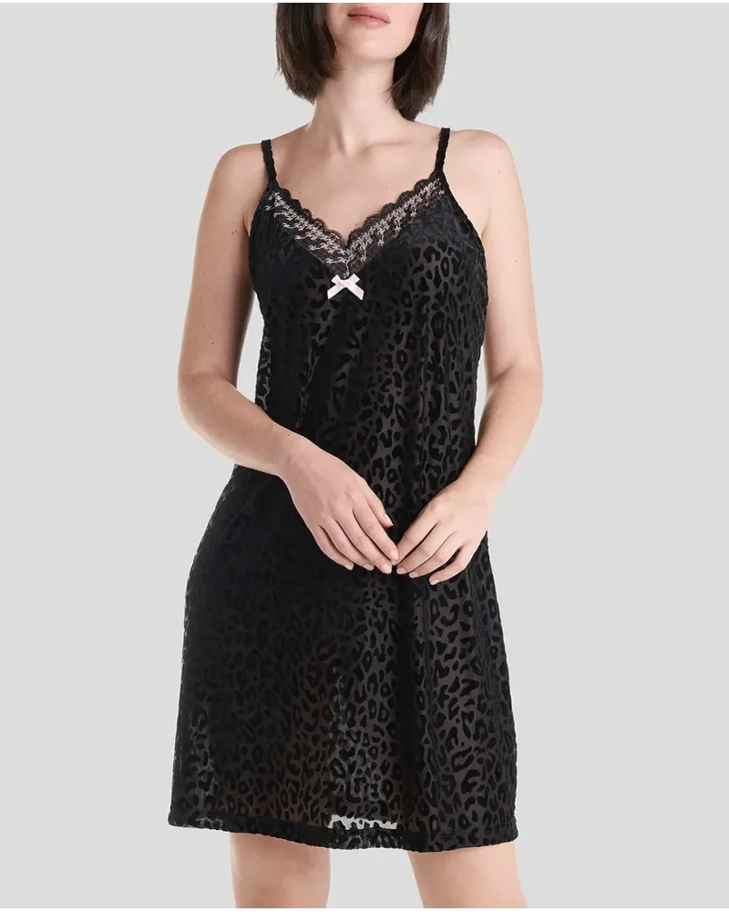 Woman in short black flocked strapless nightdress with lace trimming