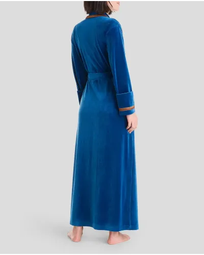Woman in blue velvet dinner jacket collar long gown