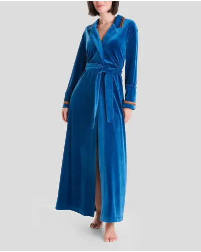 Woman in blue velvet dinner jacket collar long gown