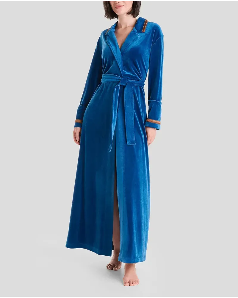 Woman in blue velvet dinner jacket collar long gown