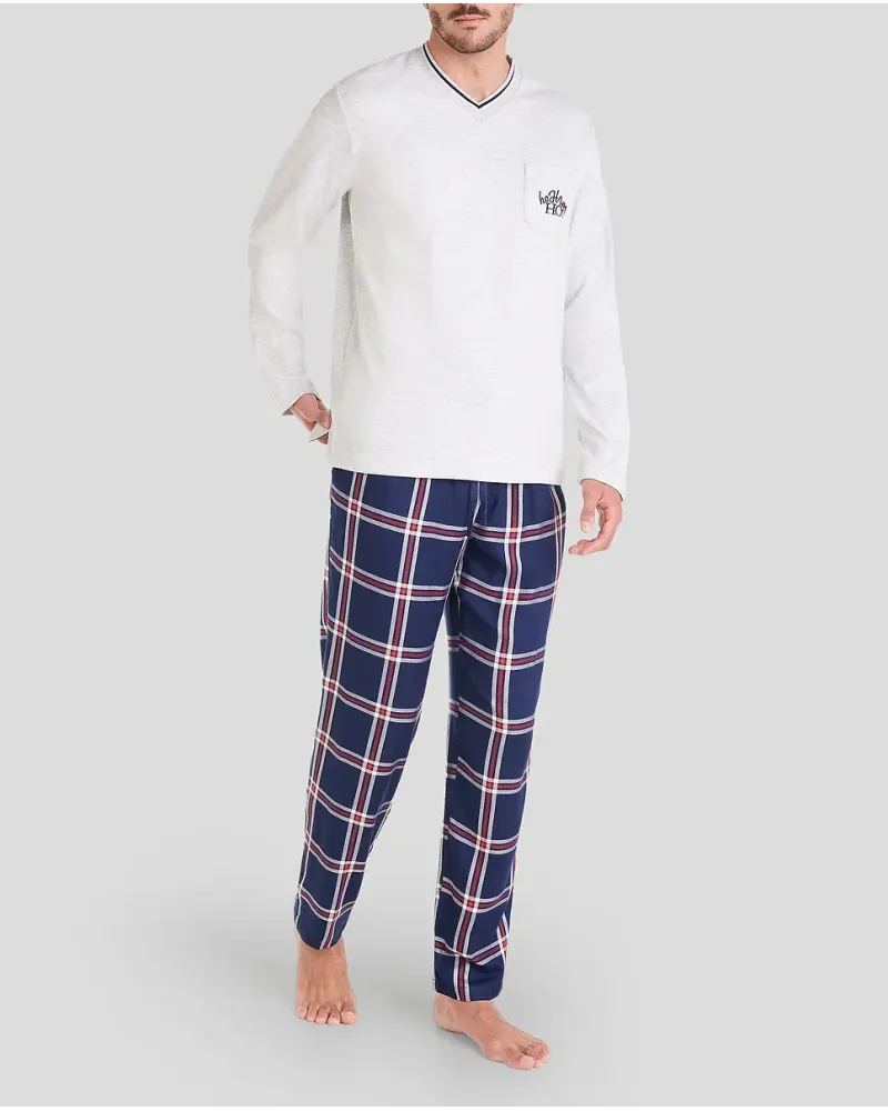 Man in long-sleeved Christmas pyjamas with checked trousers