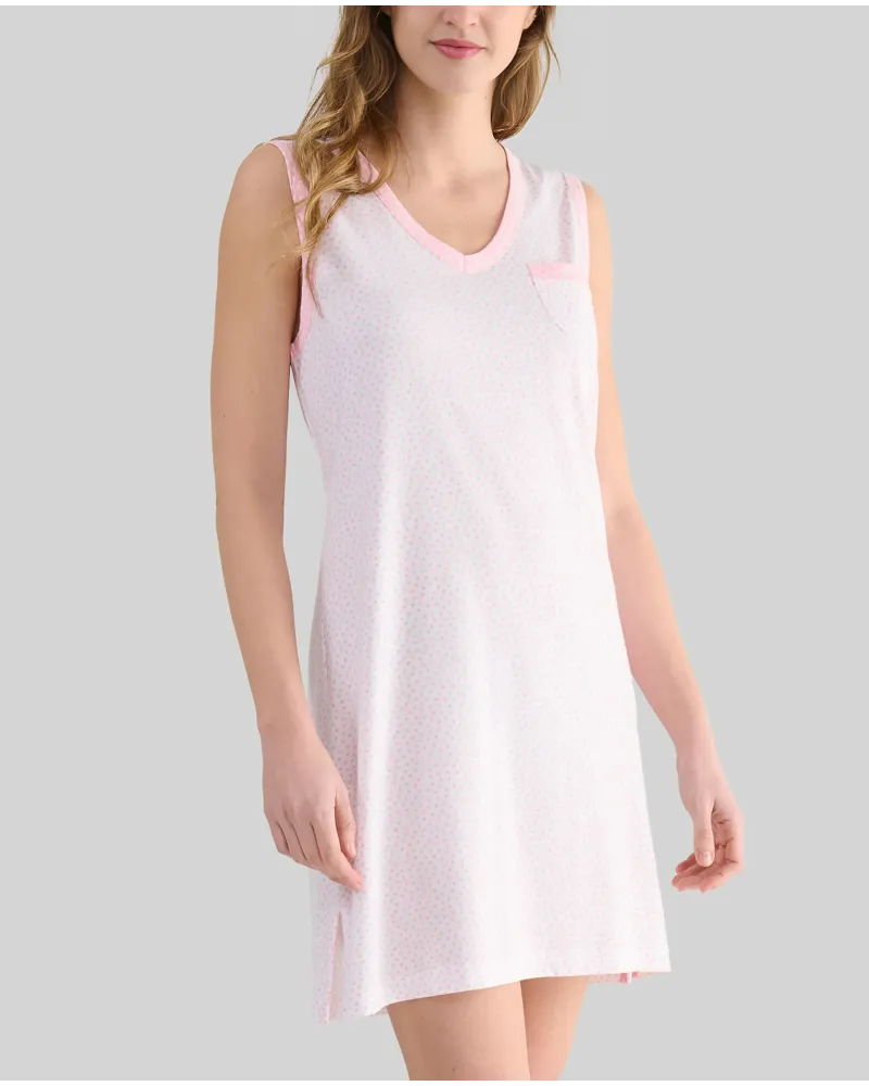 A woman with her back turned wears a light-coloured sleeveless summer camisole with delicate prints of light blue hearts.