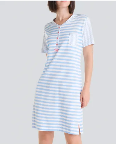 Woman wears short-sleeved summer nightgown in elegant light blue stripes and an open collar