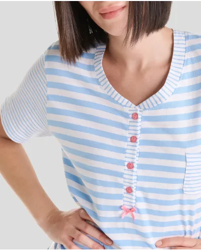 Woman wears short-sleeved summer nightgown in elegant light blue stripes and an open collar