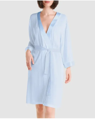 Woman dressed in elegant light blue viscose jacquard summer short dressing gown