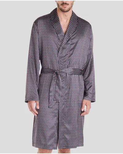 Man in short navy satin navy polka dot Christmas dressing gown