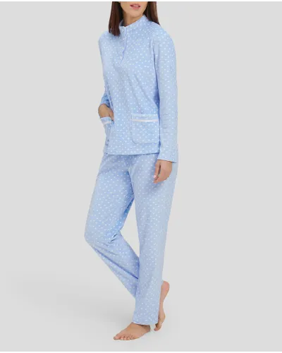 Woman in light blue winter pyjamas with little hearts