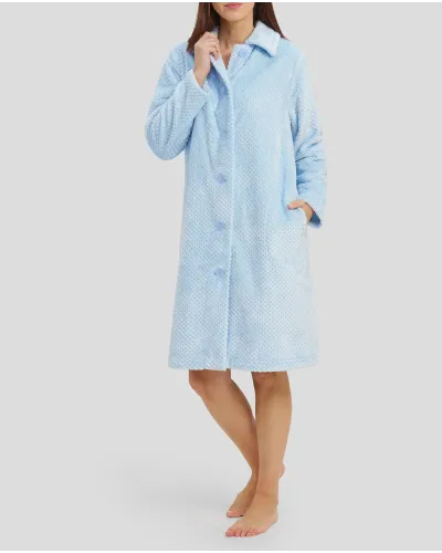 Woman with open long dressing gown with buttons and light blue side pockets