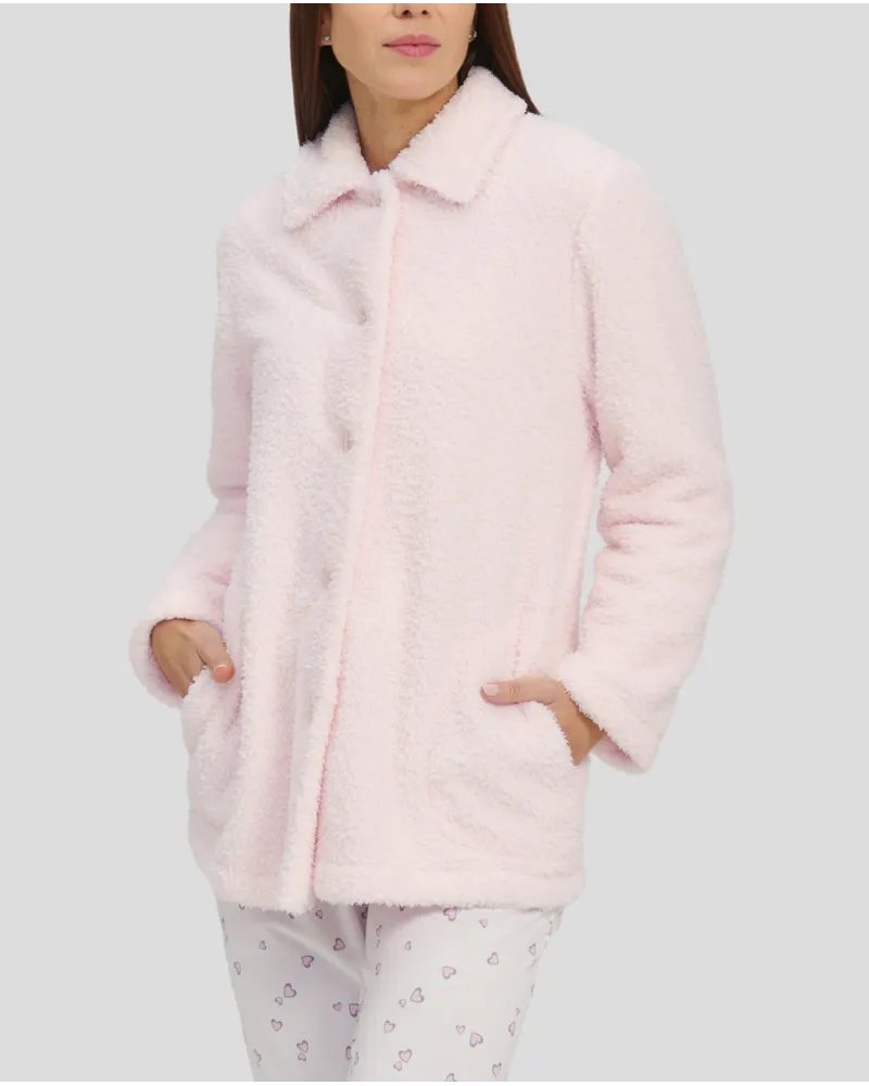Woman in short pink sheepskin dressing gown with buttons and pockets