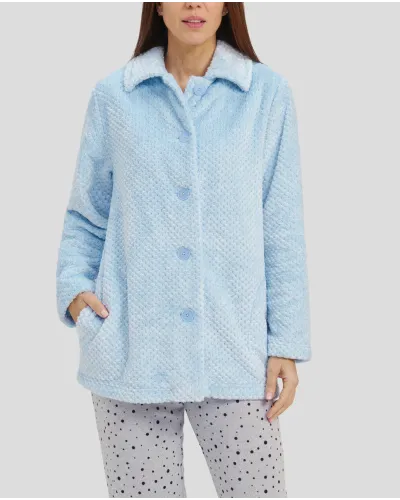 Woman in short light blue buttoned dressing gown with side pockets