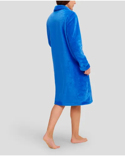 Woman in long blue winter dressing gown with zip and pockets