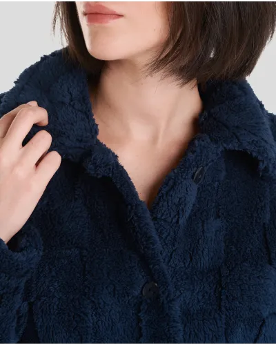 Woman in navy checkered jacquard winter long coat