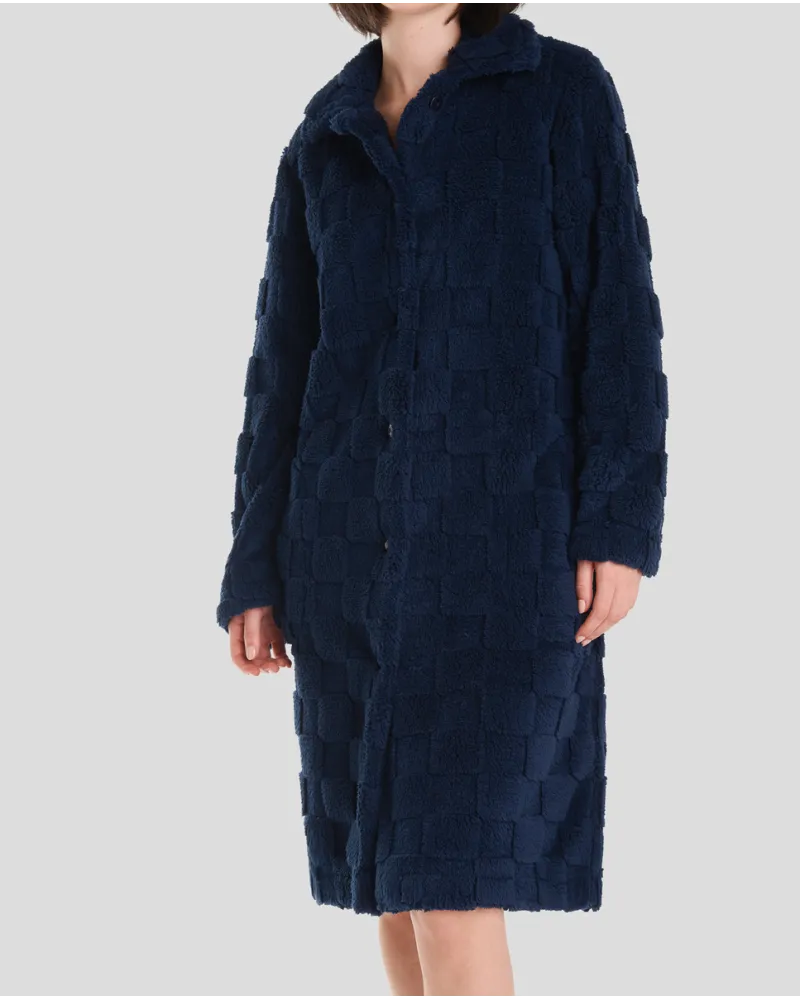 Woman in navy checkered jacquard winter long coat