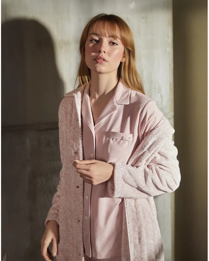 Model wears long pink herringbone winter coat