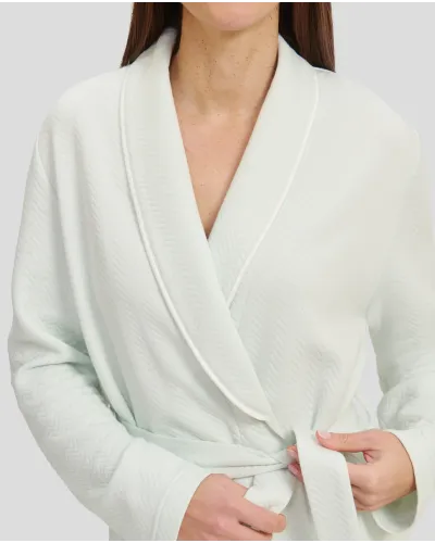 Woman in soft green jacquard double-breasted long gown with belt