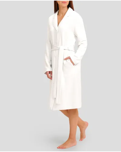 Woman in ivory winter long dressing gown with lapel collar, belt and long sleeves