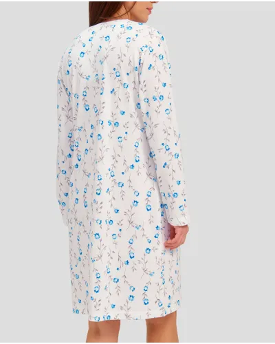 Woman with light blue flowered winter nightdress with lace collar