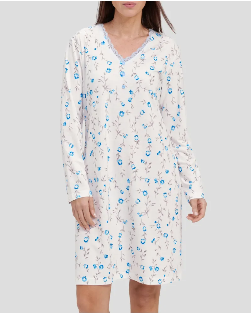 Woman with light blue flowered winter nightdress with lace collar
