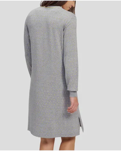 Woman with long-sleeved winter nightgown in grey with yellow diamond print