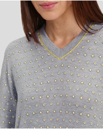 Woman with long-sleeved winter nightgown in grey with yellow diamond print