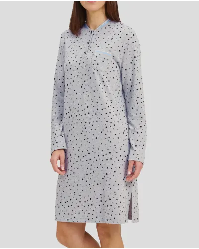 Woman in a grey winter nightdress with polka dots and cuffs