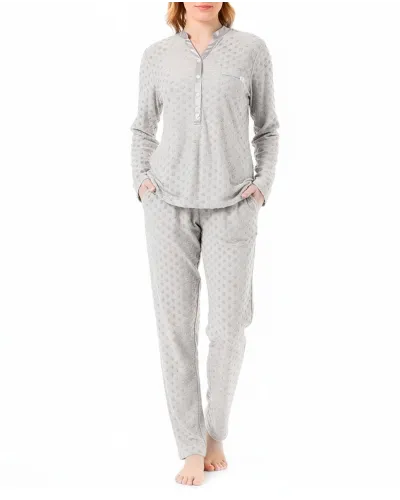 Woman in long winter pyjamas in polka dot and V-neck knitted fabric