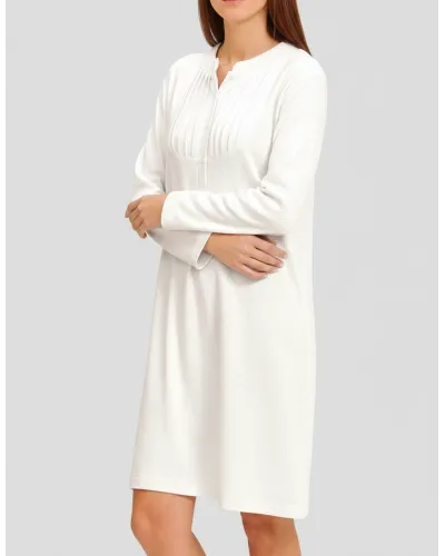 Woman in ivory long-sleeved nightgown for winter with louvres