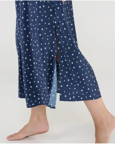 Luxury long satin nightgown with star print, delicate adjustable straps, and an elegant V-neck with a subtle decorative bow.